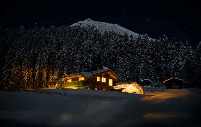 brown wooden house near trees covered with snow night star 2k