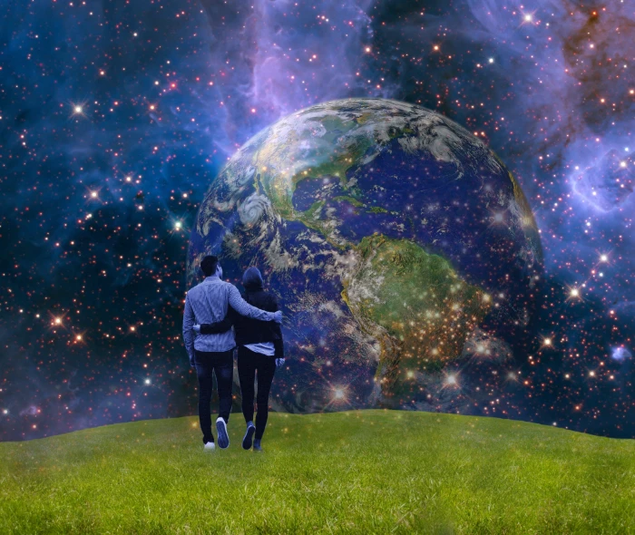 person standing on green field with universe wallpaper earth 2k
