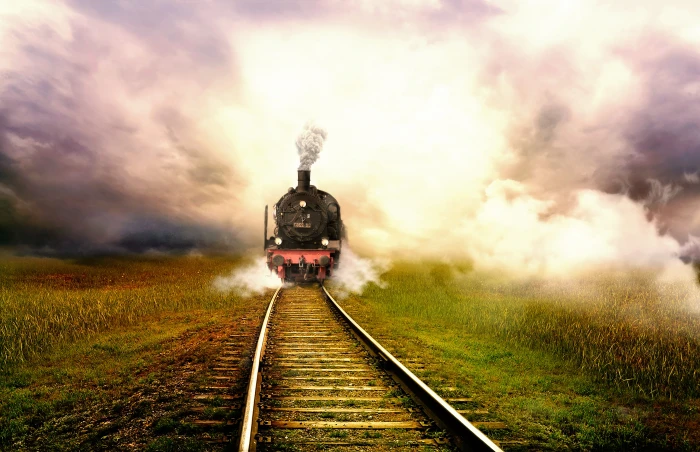 steam engine train travelling on track under white clouds landscape 2k 4k 5k