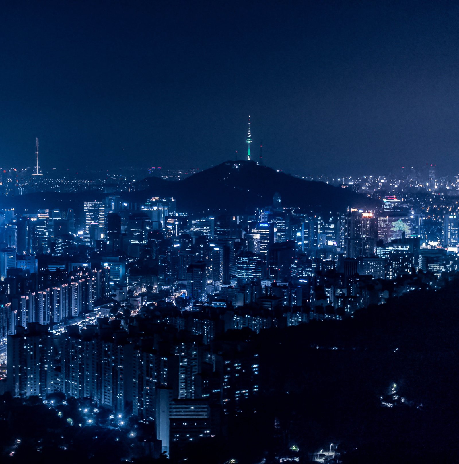 areal view with city during nighttime building light glow 2k