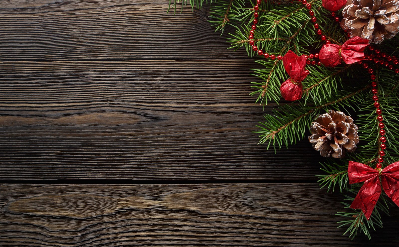 Dark Wood Table with Pine Branch and a Cone green red Christmas themed decor 2k 4k 5k
