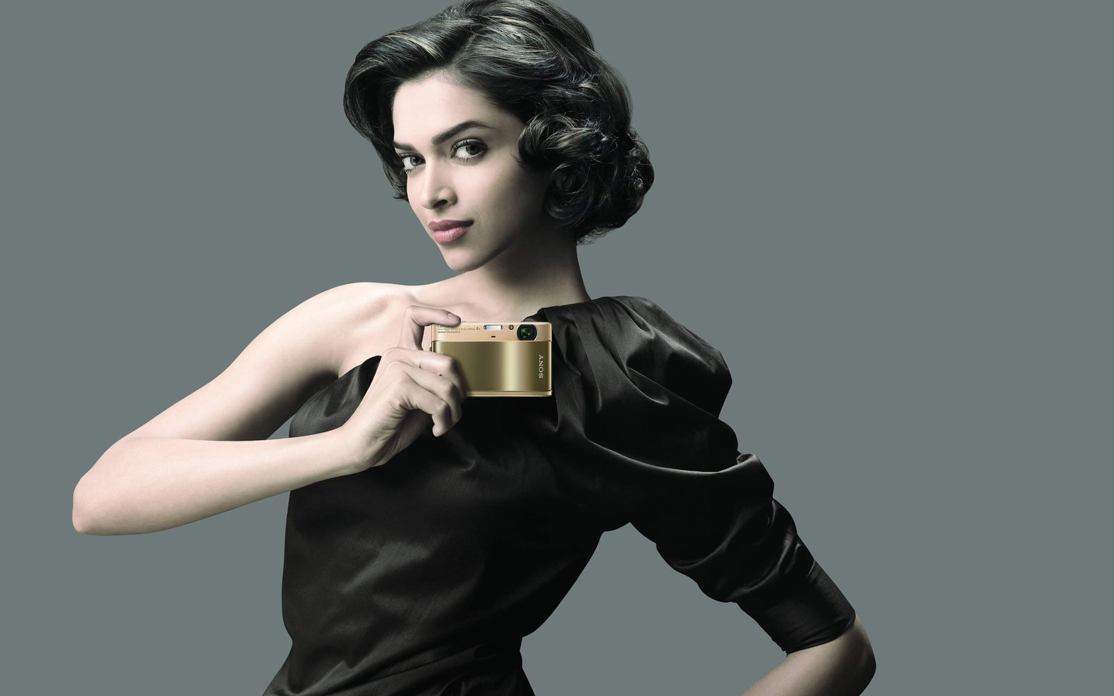 Deepika Padukone Sony women's black leather suit and compact camera 2k