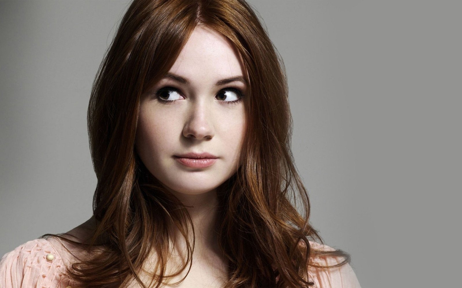 redhead actress closeup Karen Gillan simple background