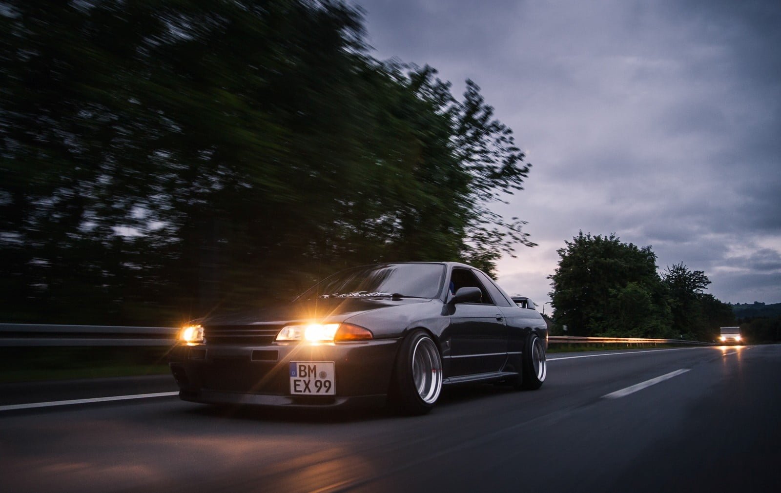 black coupe with headlight on road Nissan skyline Skyline 2k