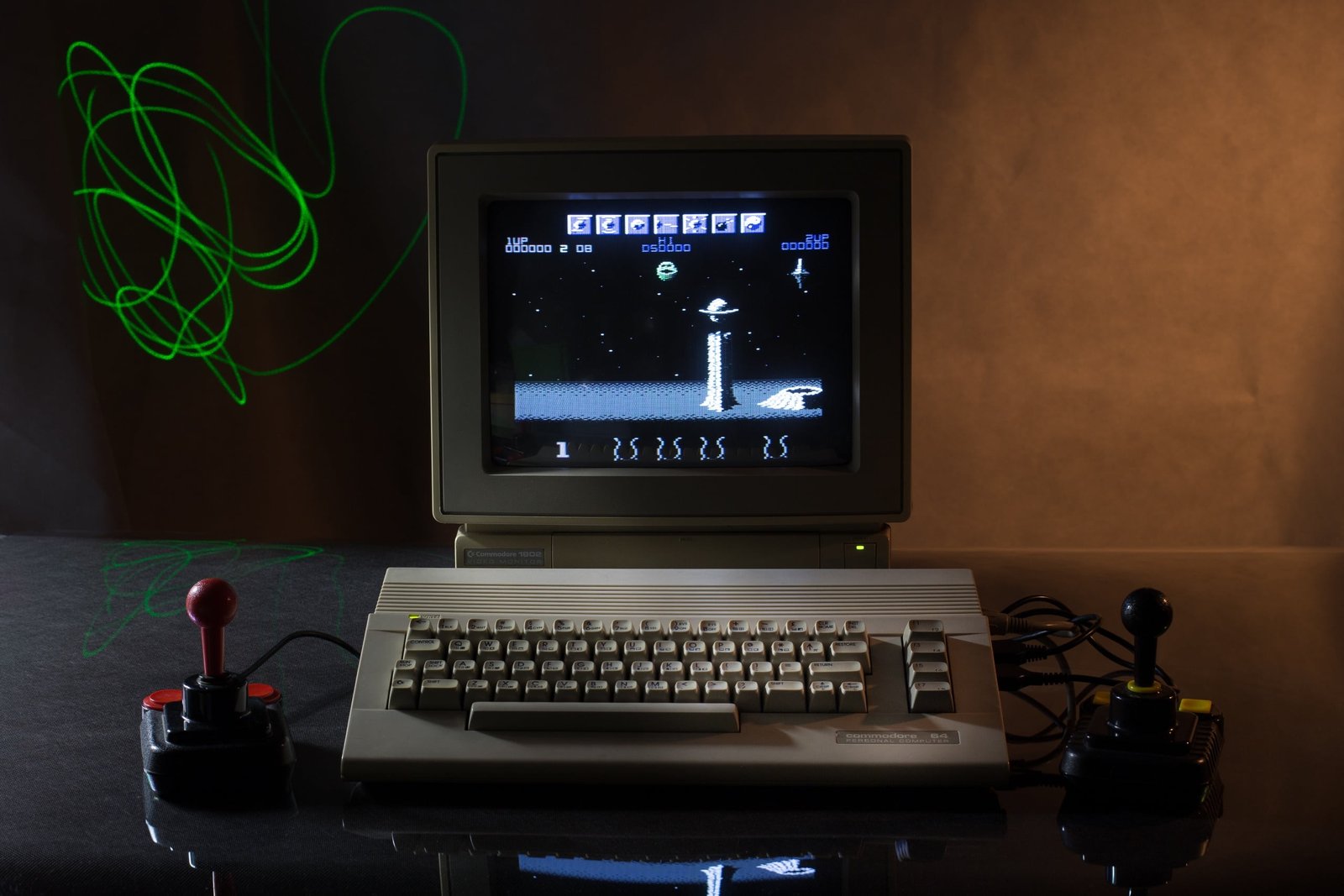 black and gray HP laptop retro games computer joystick Commodore 64 2k