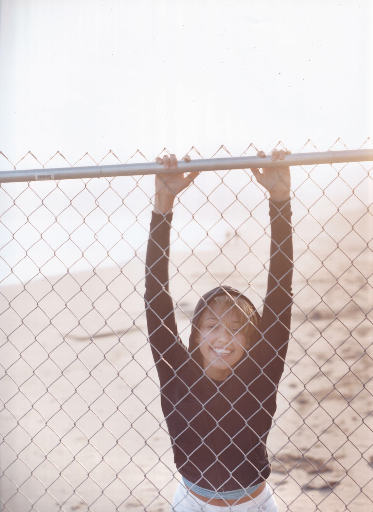 women fence beach hoods Jessica Alba one person boundary