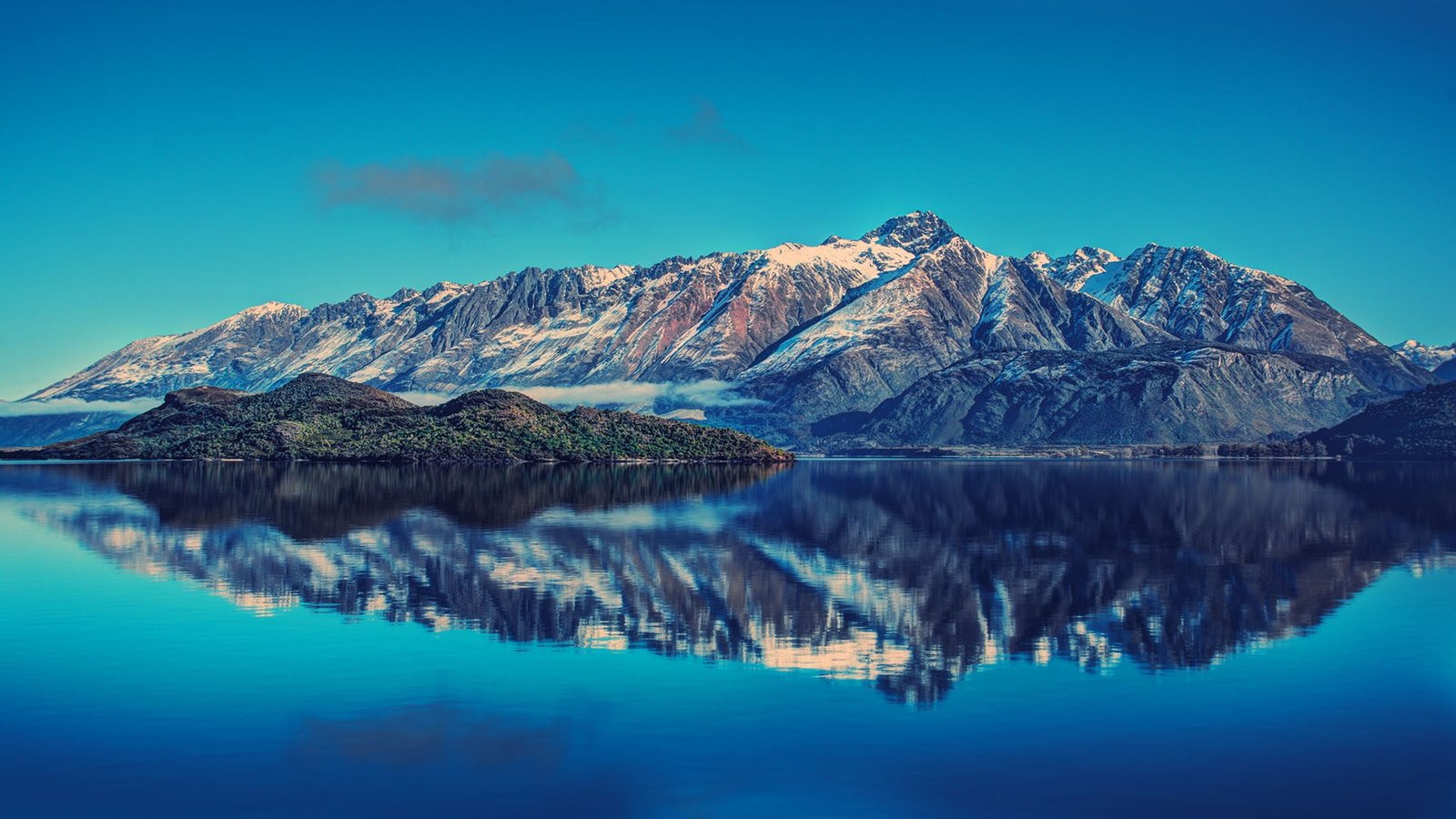 mountain ranges and body of water selective focus photography island 2k
