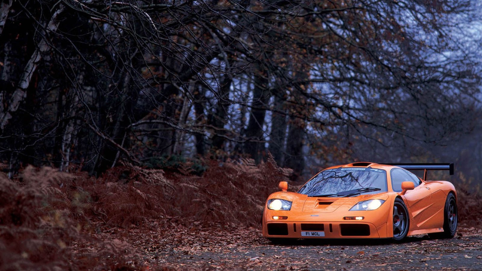 orange supercar McLaren trees fall supercars 2k