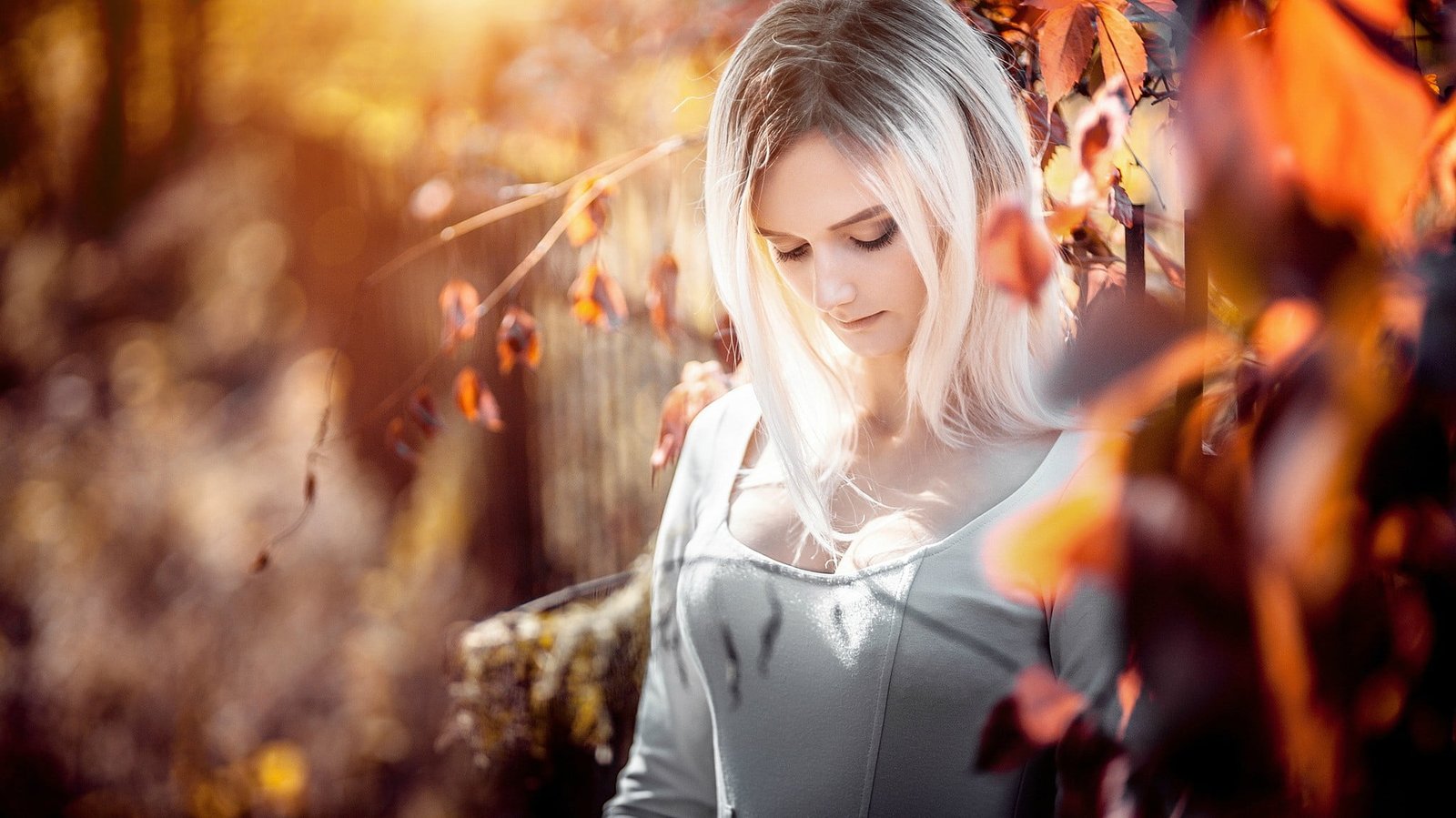 women's gray scoop neck top woman wearing white boat long sleeved shirt standing near brown leaf tree at daytime 2k