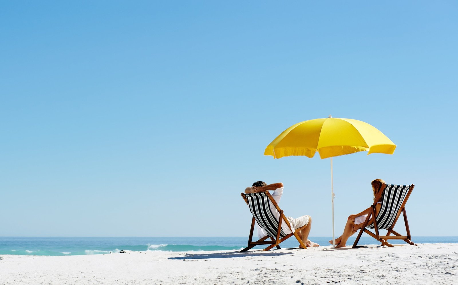 beach water sea umbrella sky land protection clear 2k 4k