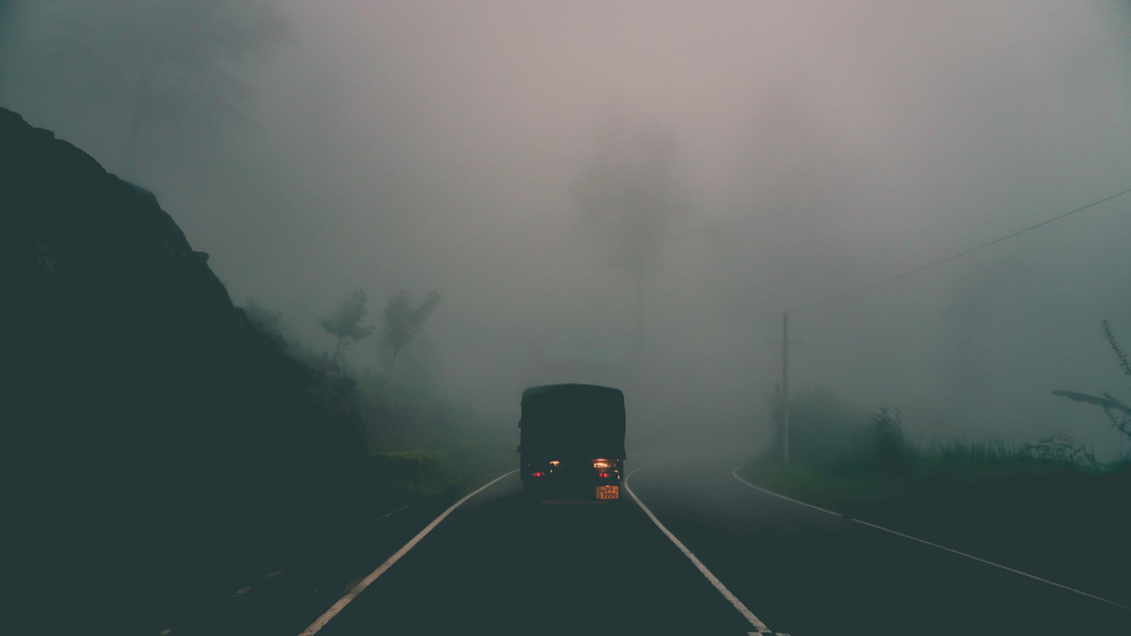 black vehicle in foggy road truck car haze mountain tree 2k 4k 5k