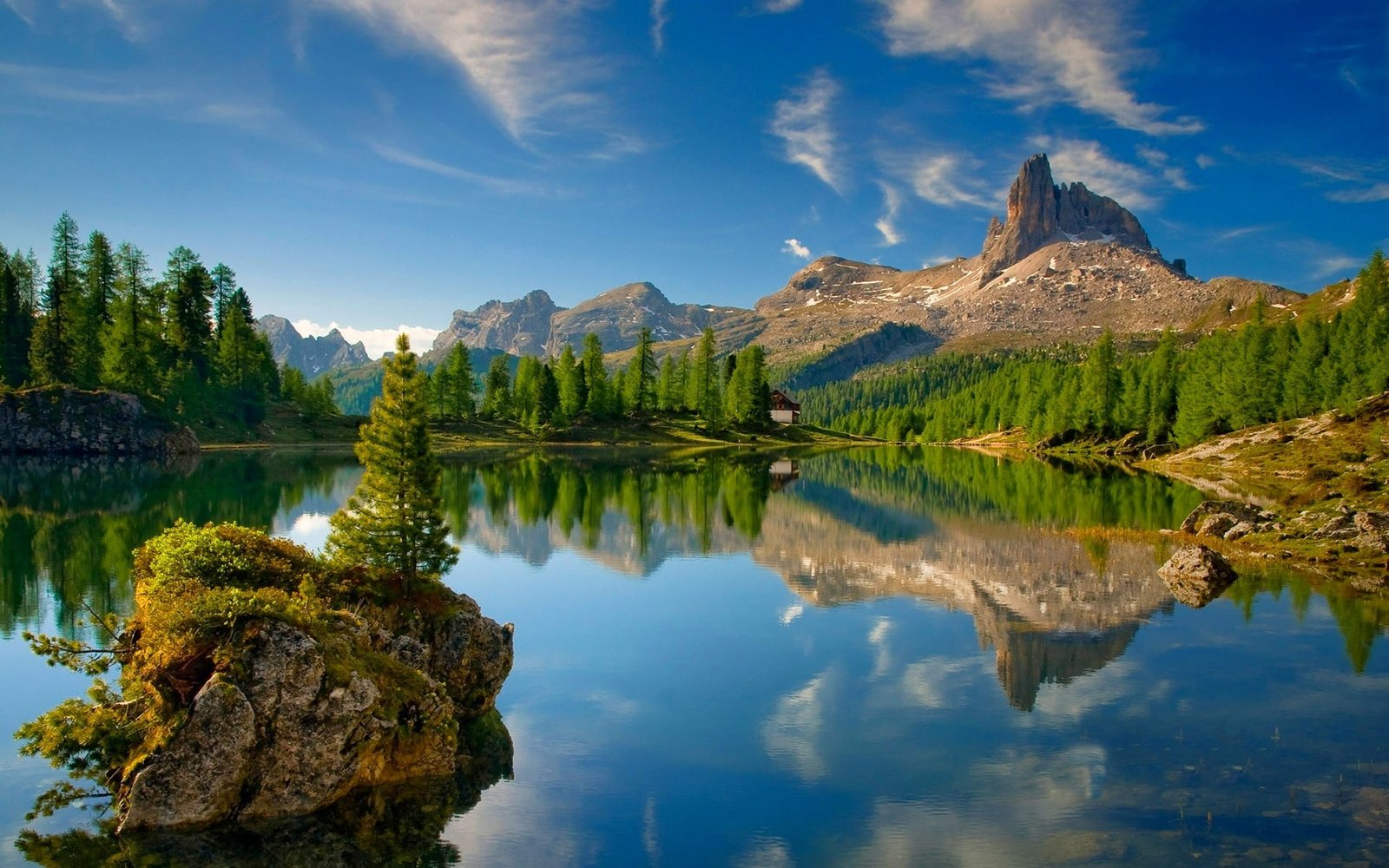 lake surrounded by pine trees Dolomites mountains forest 2k