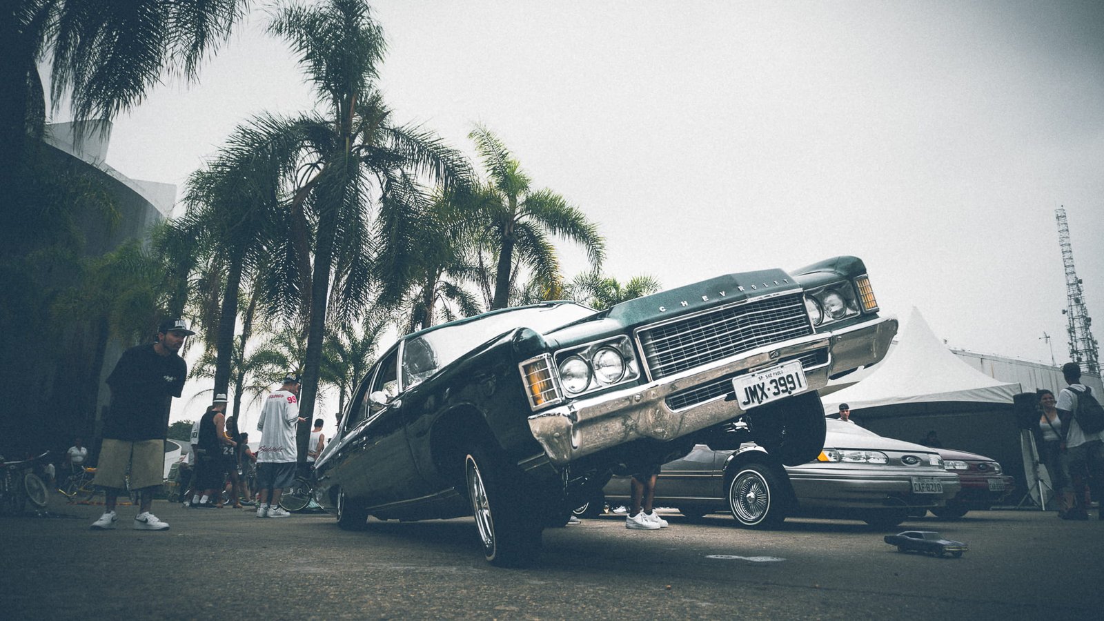 cars road vehicles landscape blur chevrolet daylight low rider 2k