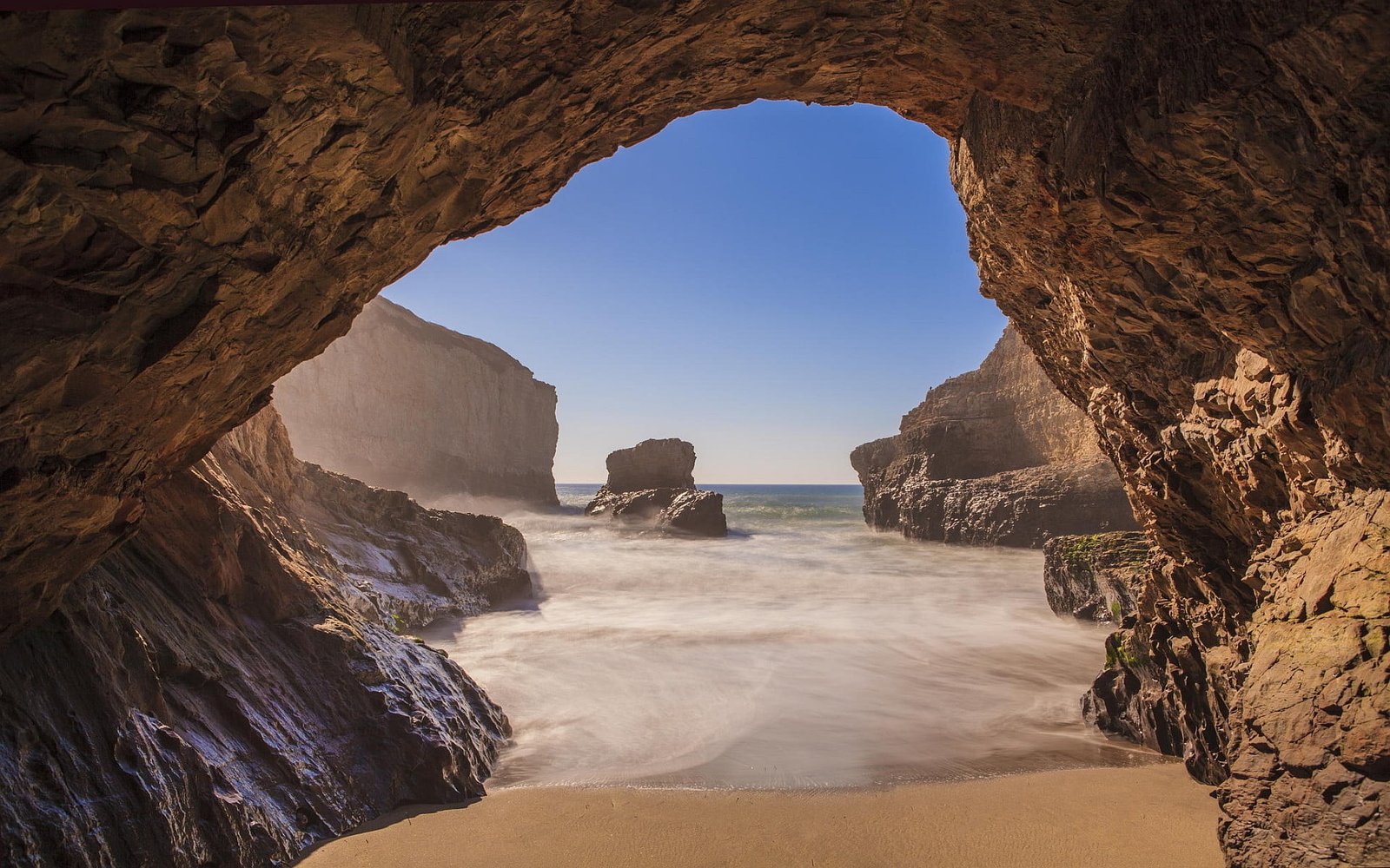 brown rock formations beach nature landscape sea cave object 2k