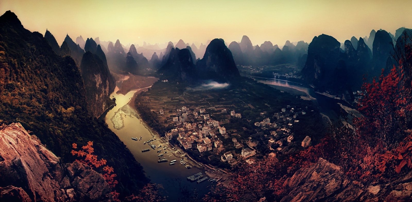 brown mountains painting bird s eyeview photo of body water surrounded by mountain 2k
