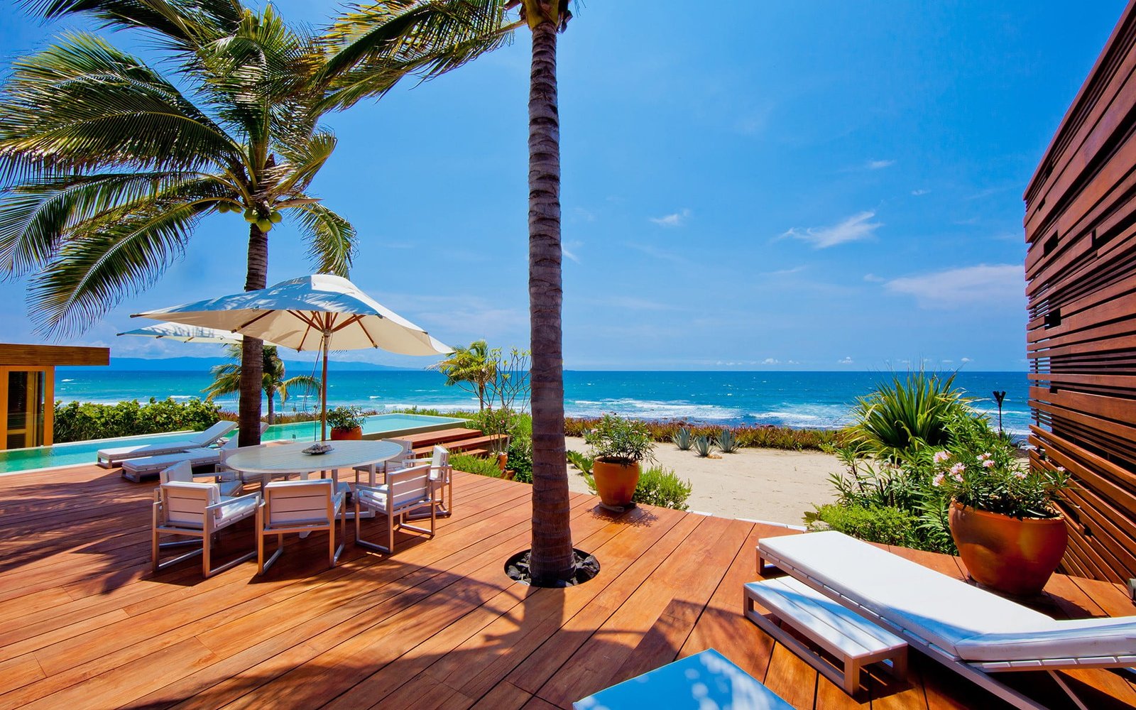 white wooden 5 piece patio set on overlooking sand beach 2k