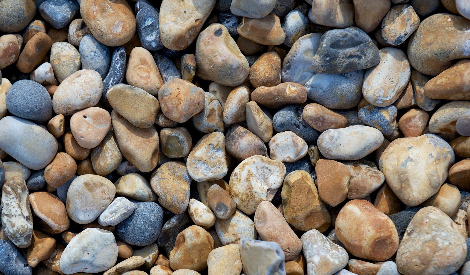 brown and gray rocks macro stones beach pebbles solid large group of objects 2k