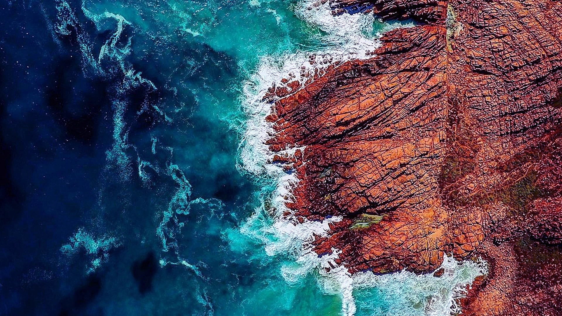water rock wave drone view aerial coast coastline 2k