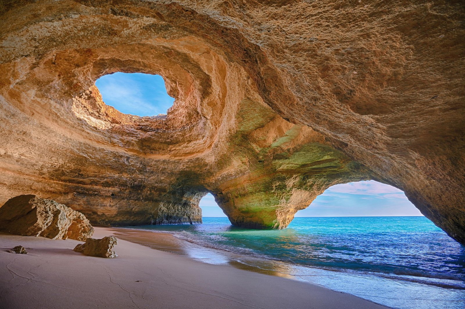 brown cave on shore nature sea beach rock formation 2k