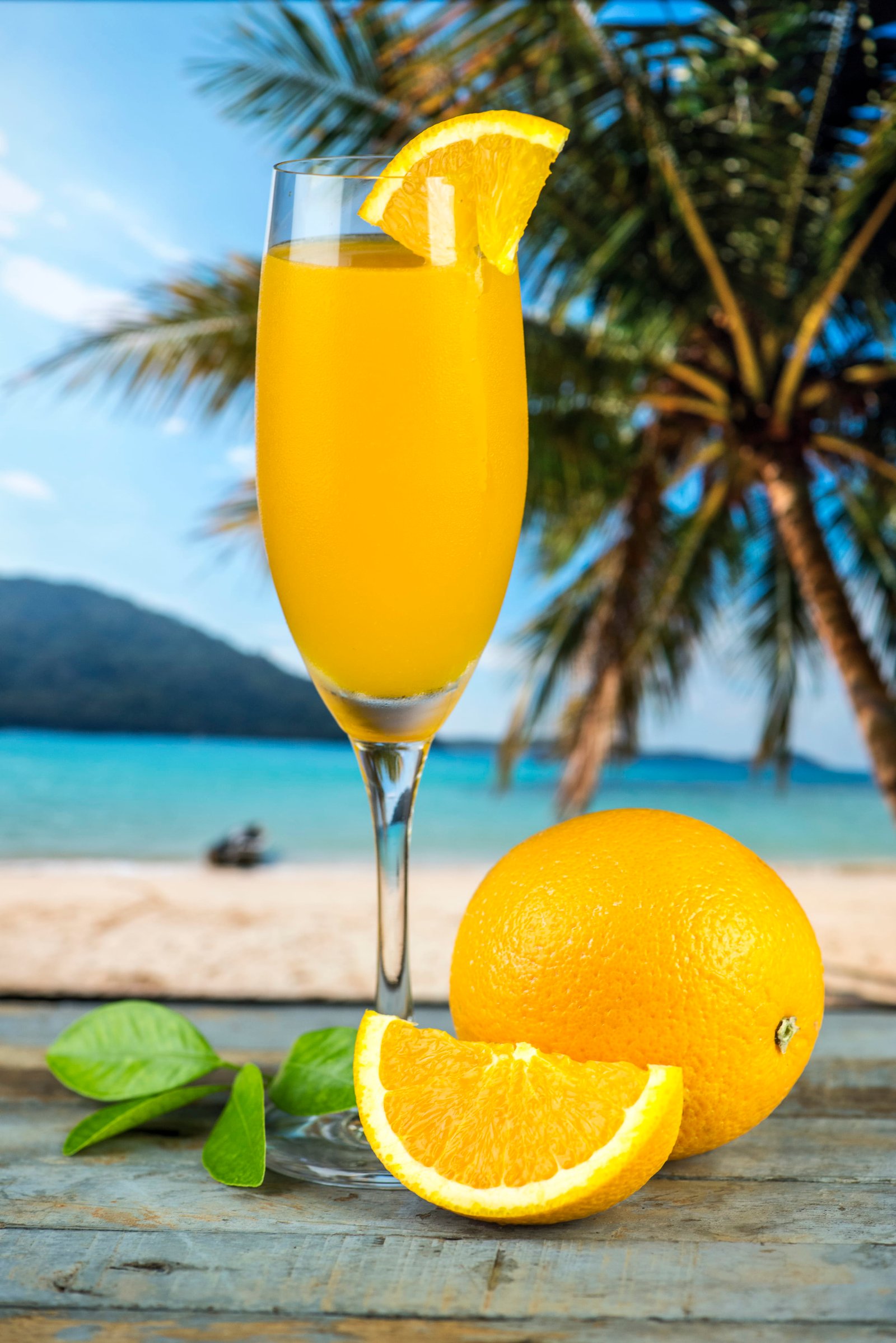 Sliced Orange Fruit Beside Long stemmed Glass Filled With Liquid 2k