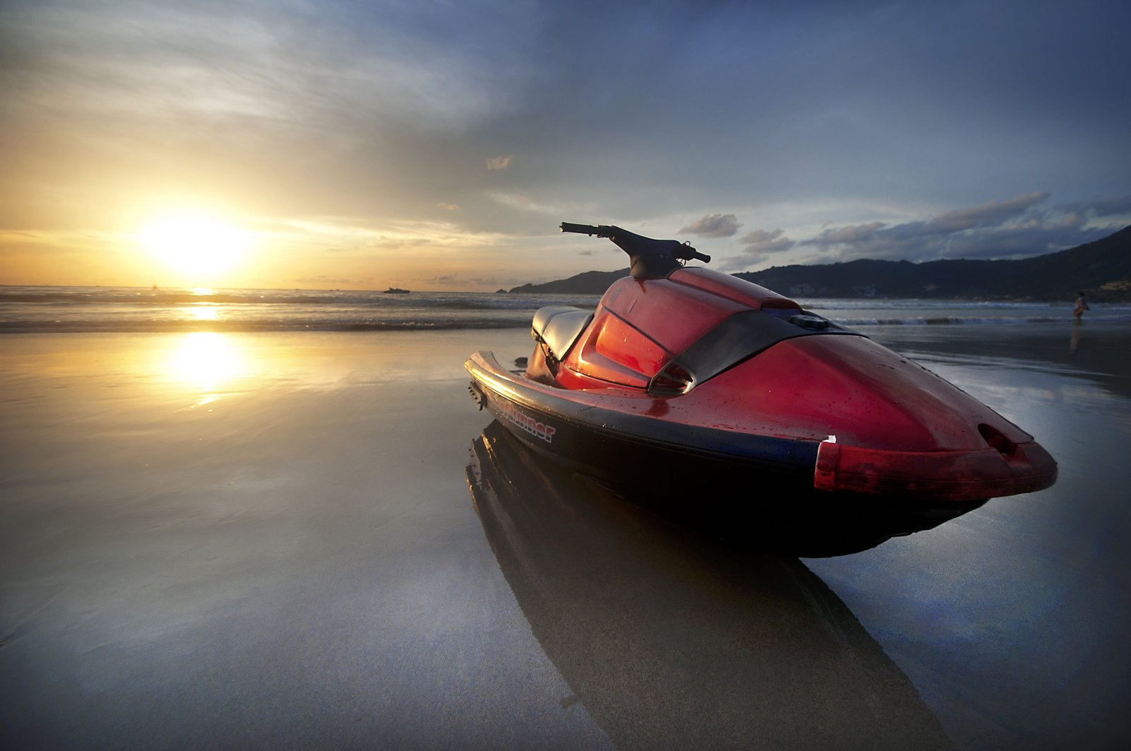 empty red and black person watercraft on sand jet ski jetski 2k 4k
