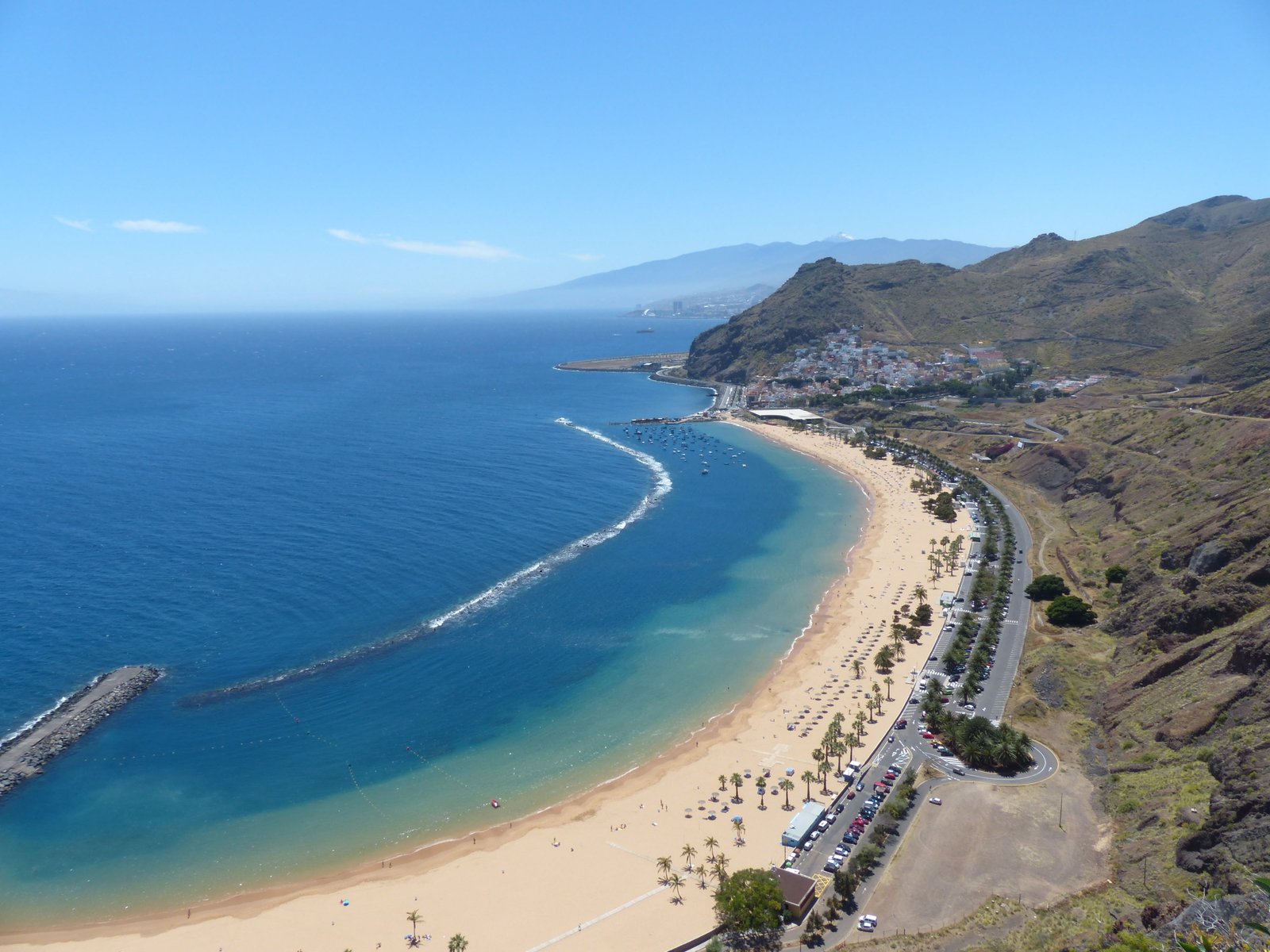 aerial view of shoreline beside mountain beach water sea coast 2k 4k