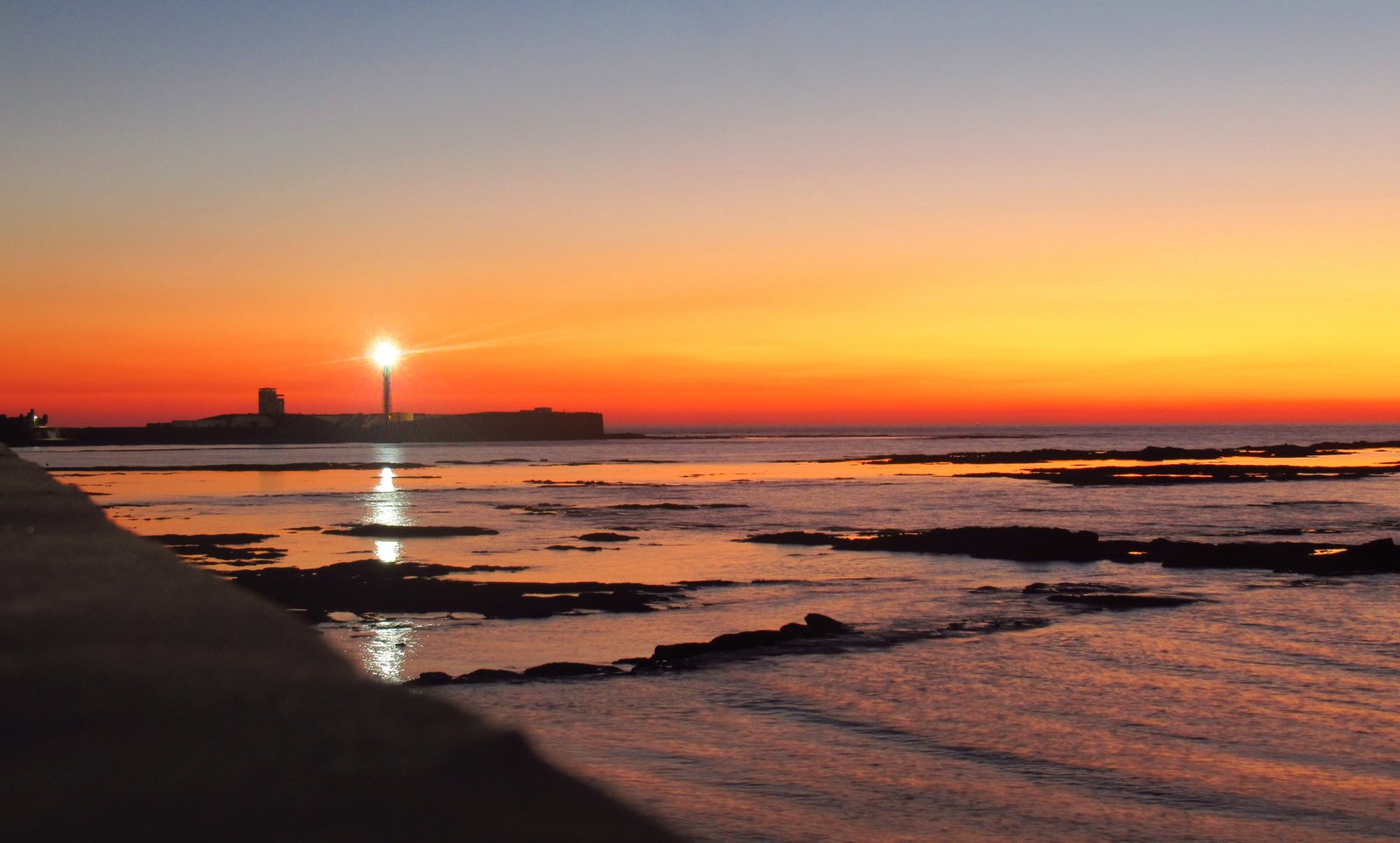 cadiz sunset beach lighthouse andalusia water tide sky 2k 4k 5k