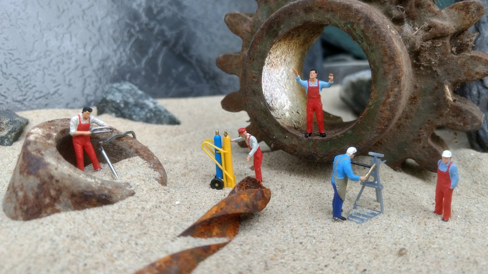 close up photography of five men in assorted color overalls figurines 2k 4k 5k