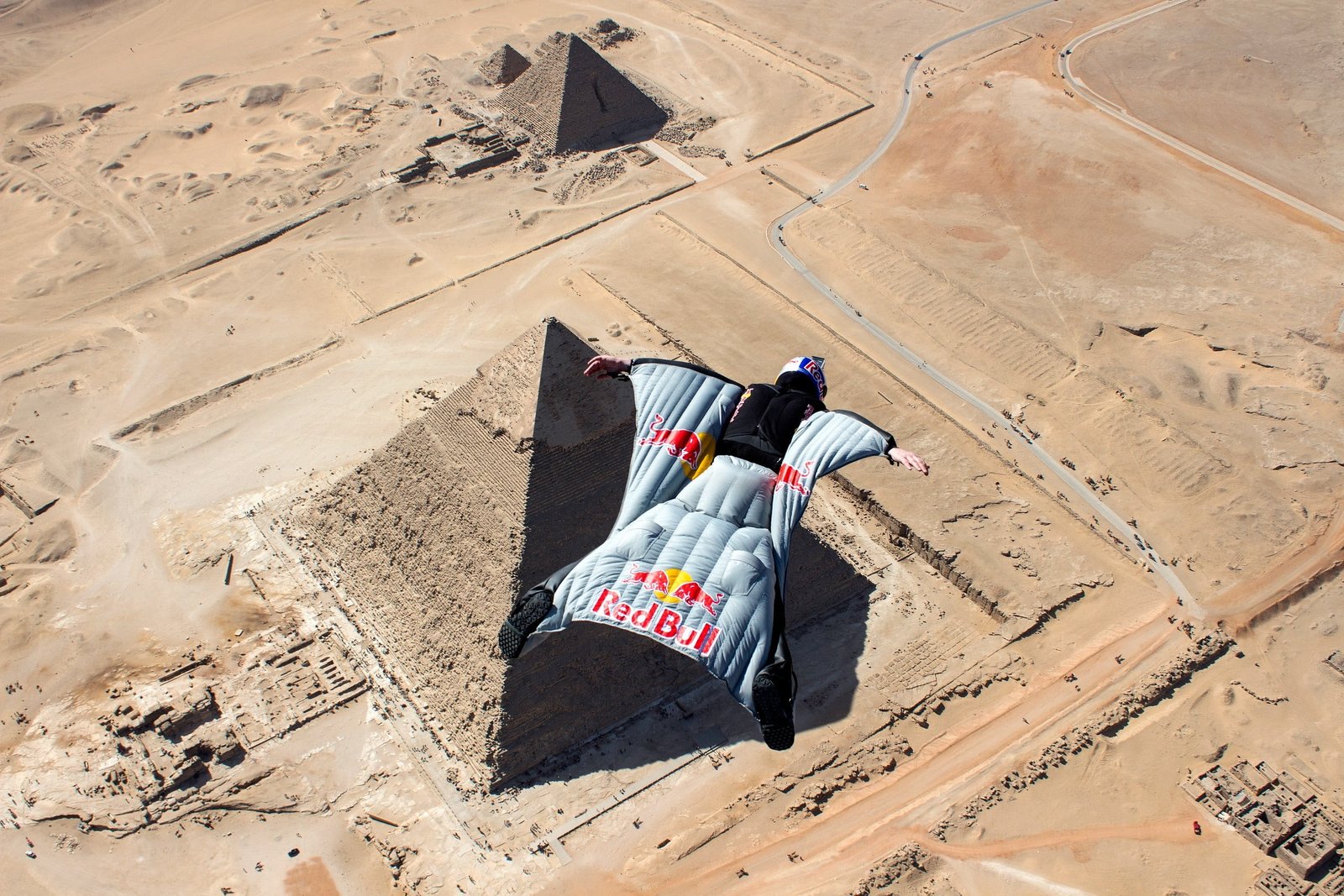 man in gray glider suit men sports parachutes jumping bird s eye view 2k