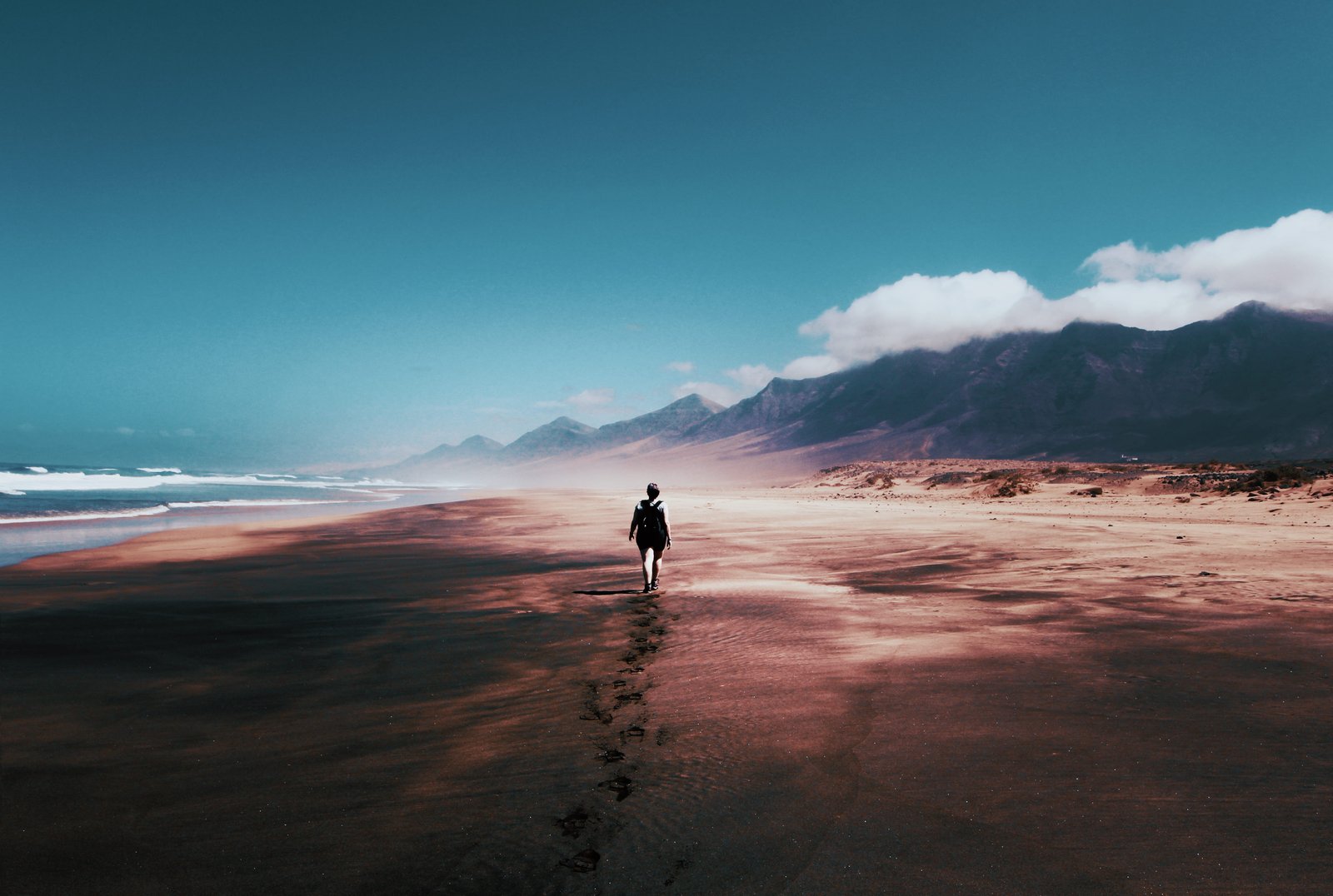 Photo of Person Walking on Deserted Island beach blue skies 2k 4k 5k