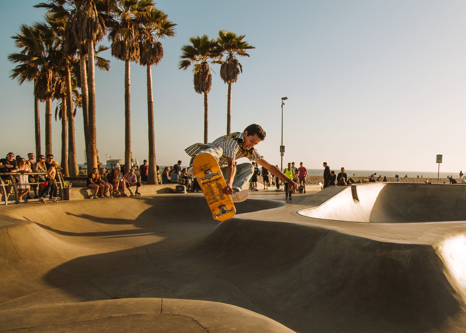 time lapse photo of man riding skateboard at skate park person 2k 4k