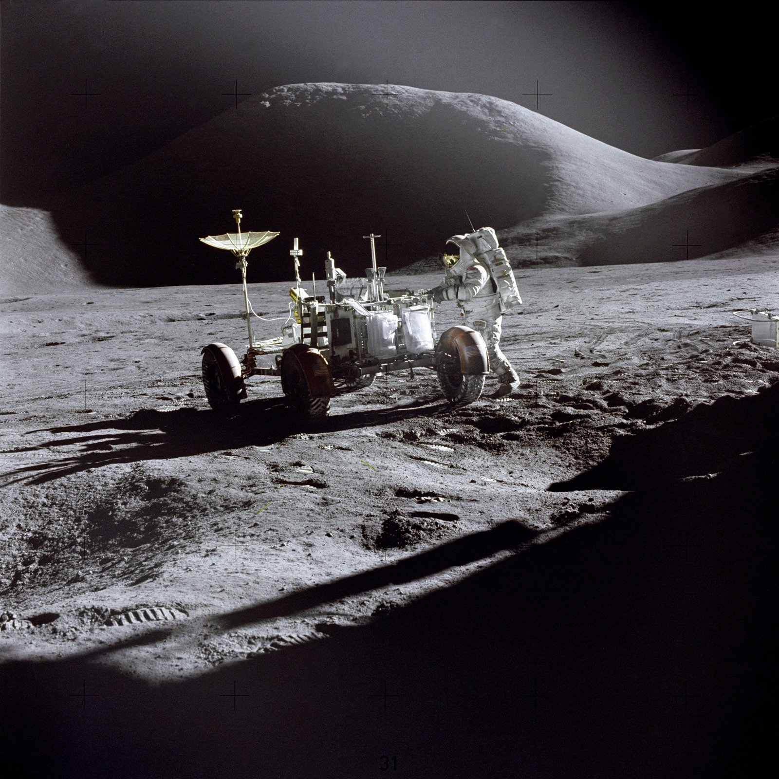 astronaut holding electronic machine with wheels on outer space 2k