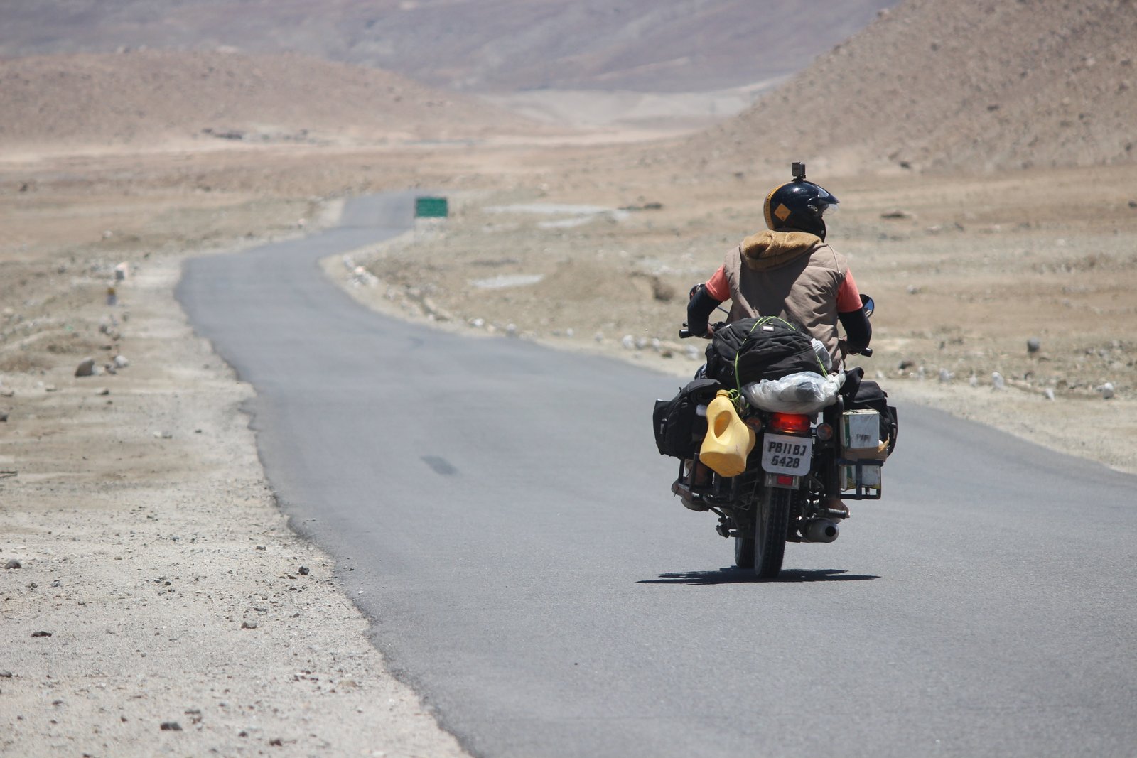 person driving motorcycle at road rider himalyan bullet blue 2k 4k 5k