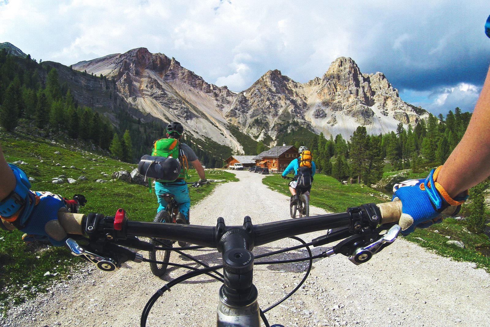 A man riding on a bicycle in mountains people adventure 2k