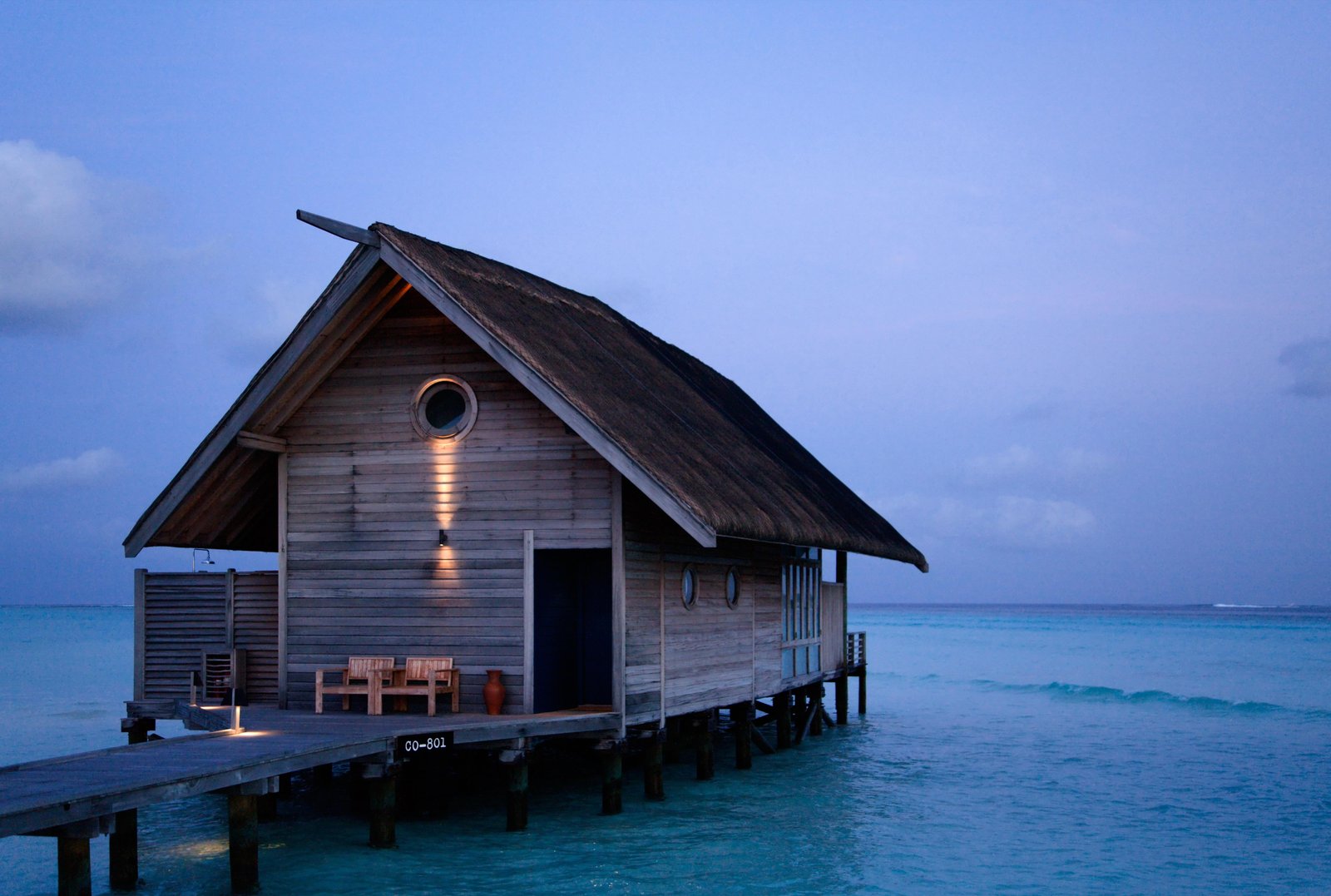 brown wooden seashore dock and house on sea water photography maldives 2k 4k 5k