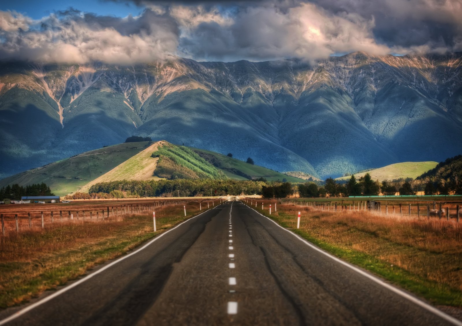 empty asphalt road across mountains Long Road to New Zealand 2k 4k 5k