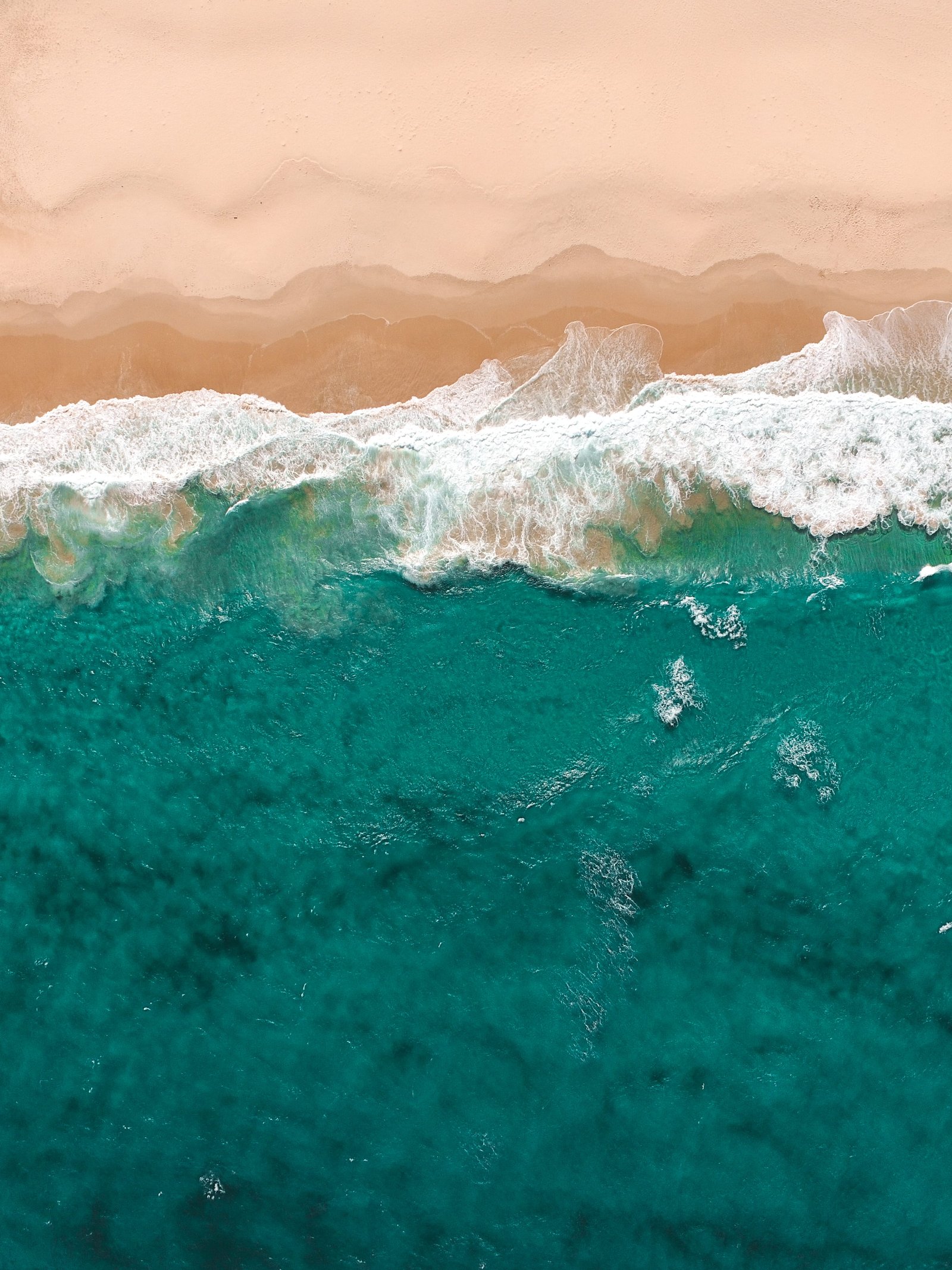 iPhone wallpaper aerial view of flowing sea water beside seashore 2k