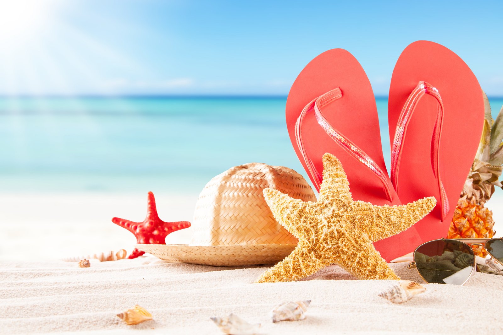 pair of red flip flops and yellow starfish sand sea beach 2k 4k 5k