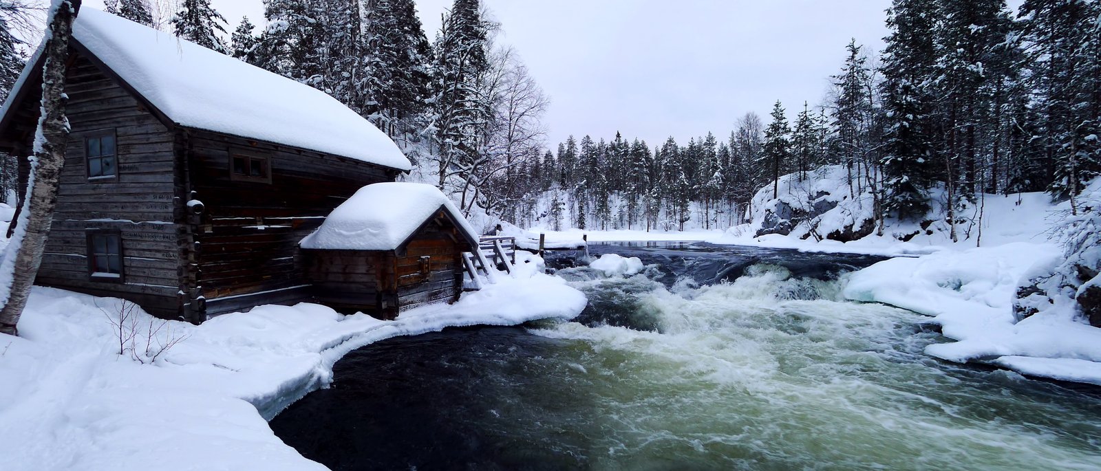 brown wooden cabin house during winter season Myllykoski karhunkierros 2k 4k 5k