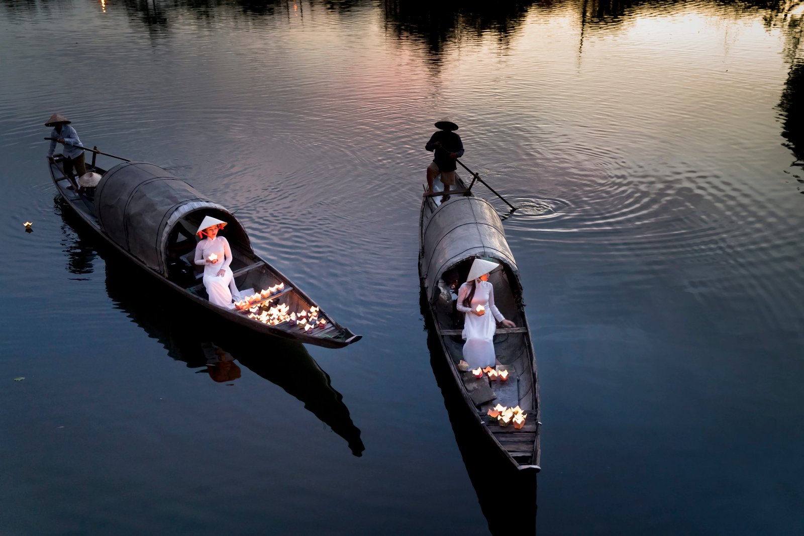 Four Person Using Two Boats on Calm Sea action ao dai boatman 2k 4k 5k 8k