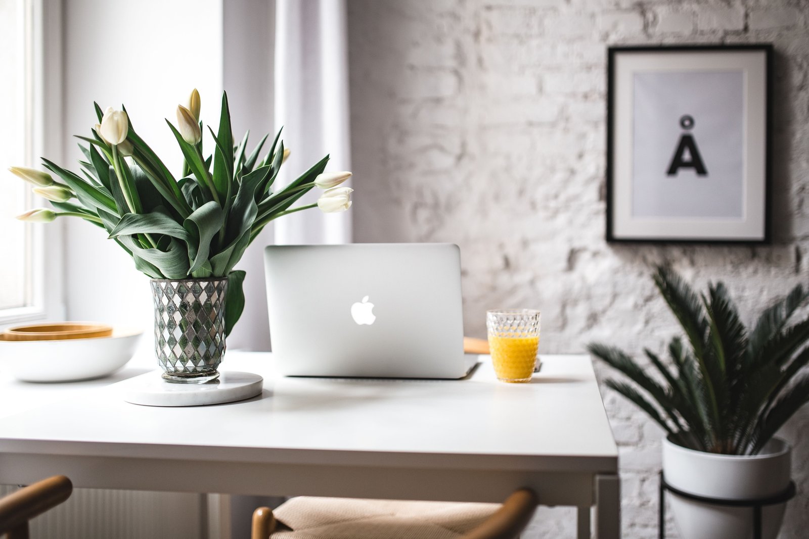 Stylish workspace with Macbook Pro interior white office workplace 2k 4k 5k