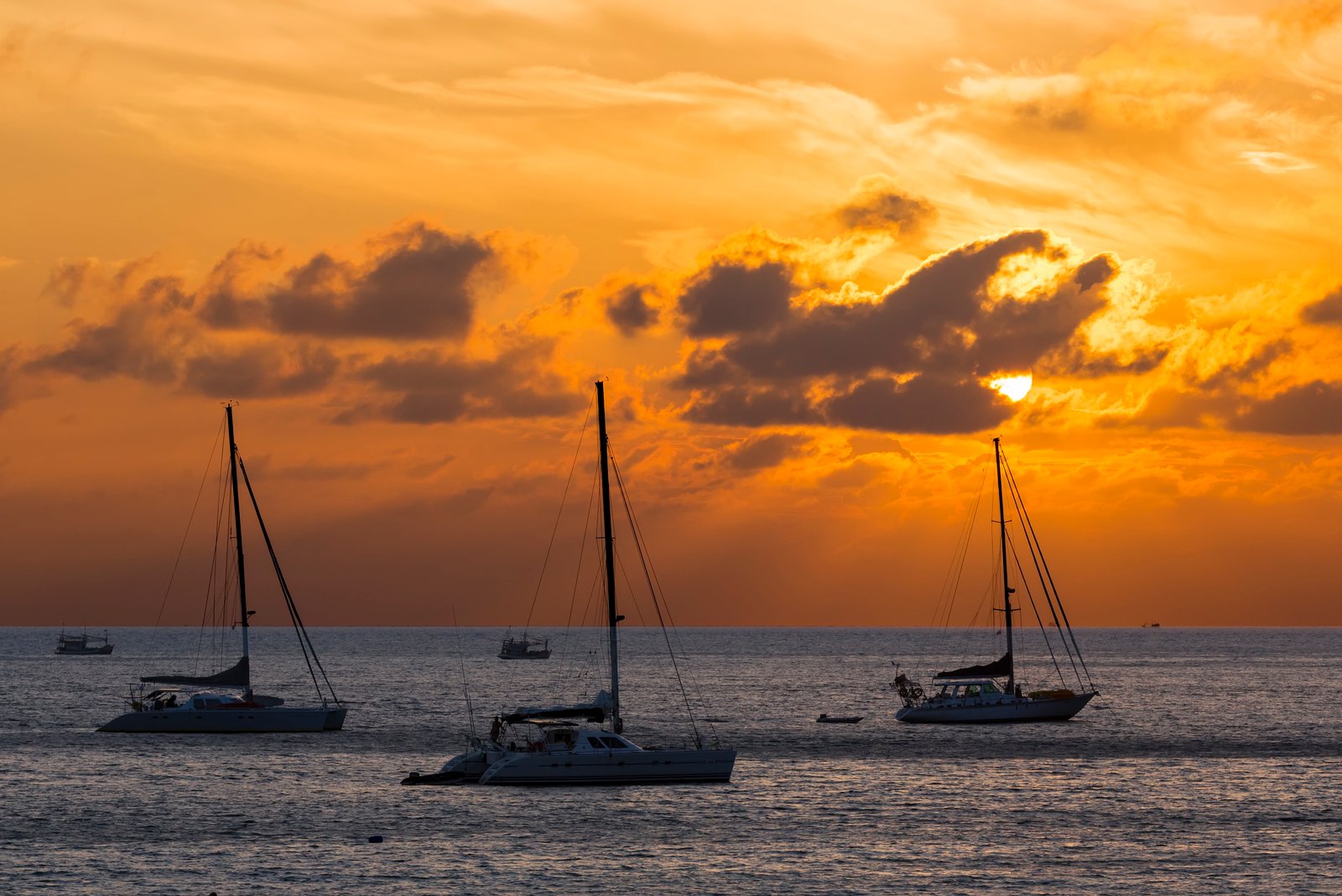 three yacht on large body of water under cloudy sky during sunset thailand 2k 4k 5k
