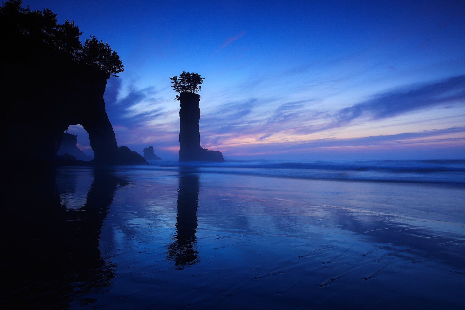 blue body of water under and orange sky during sunset time 2k 4k 5k