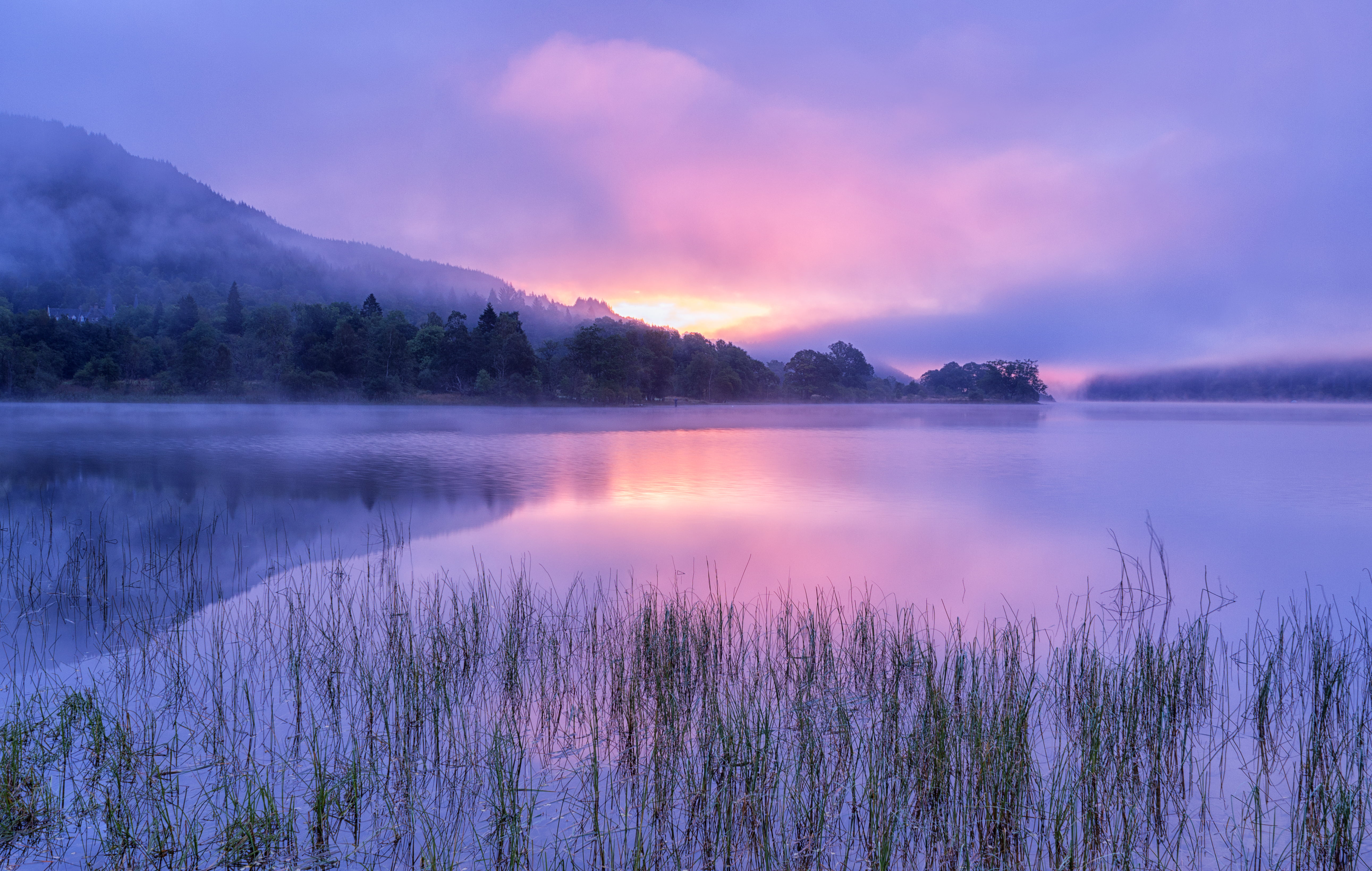 lake with mountain silhouette during golden hour loch achray 2k 4k 5k