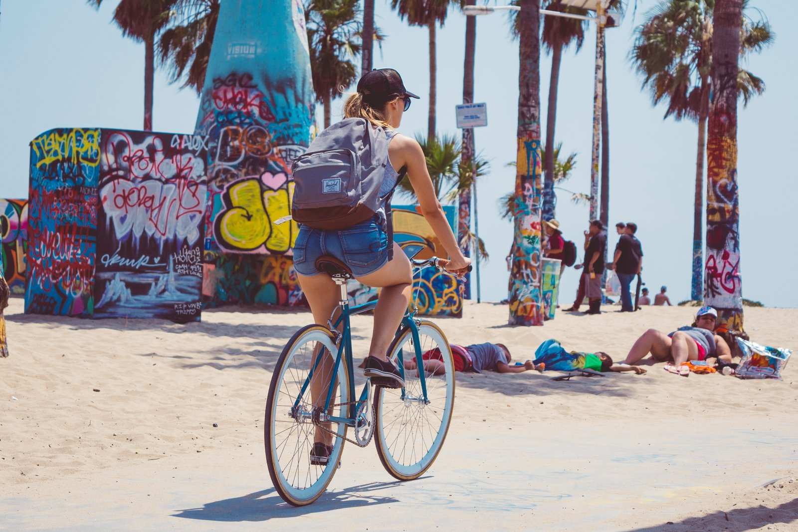woman riding on bicycle near beach bike 2k 4k 5k