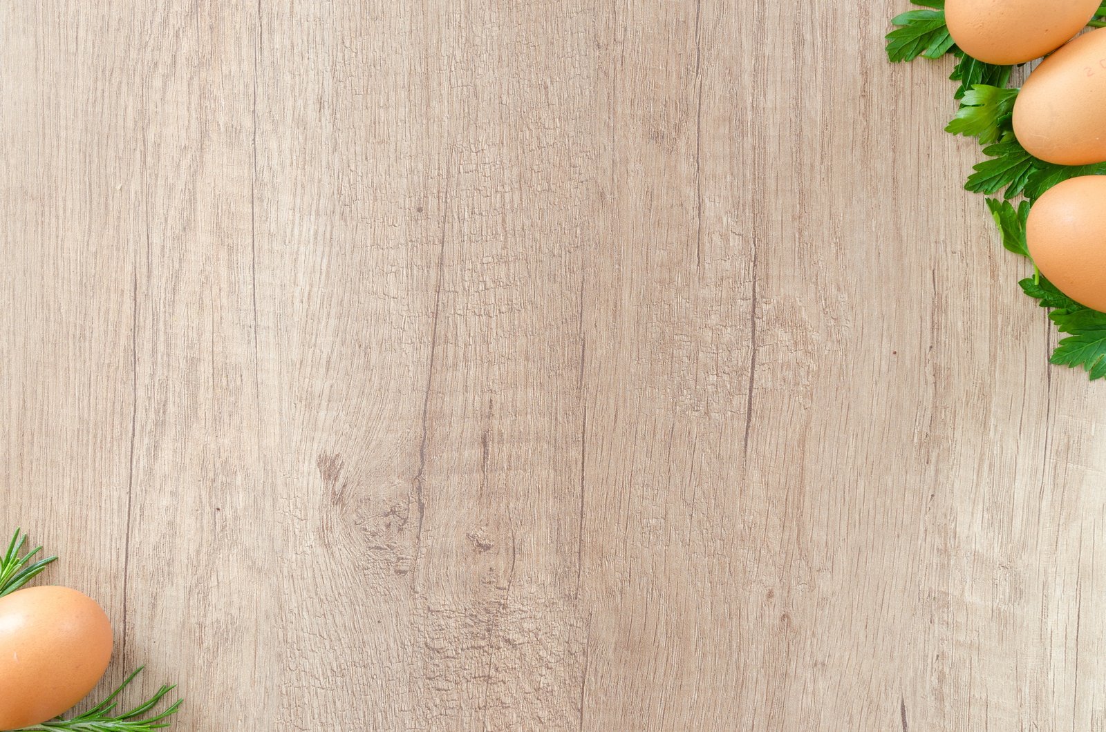 brown eggs on top of green leaf vegetables wooden surface 2k 4k 5k