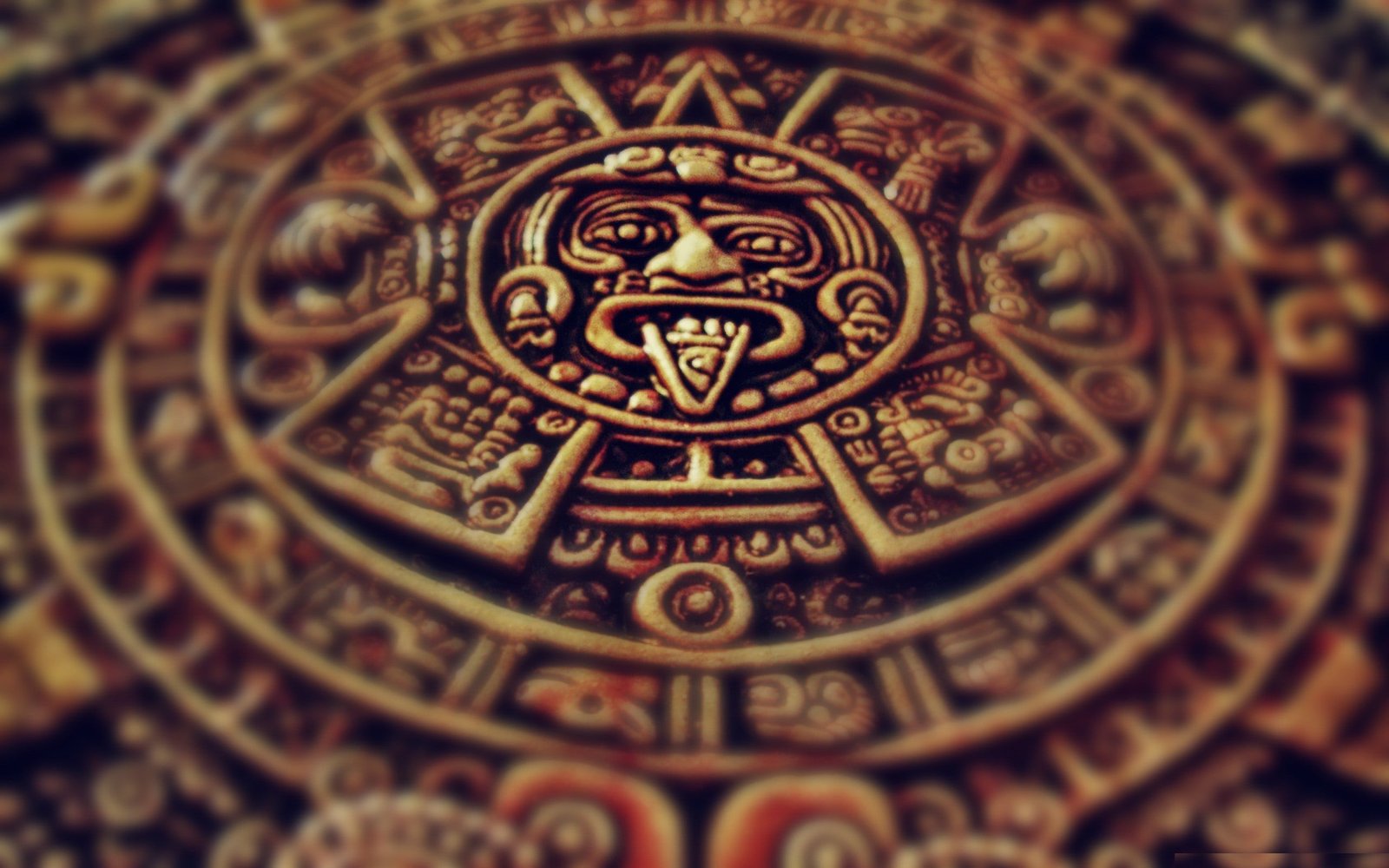 gold colored accessory Aztec depth of field metal zoma calendar 2k