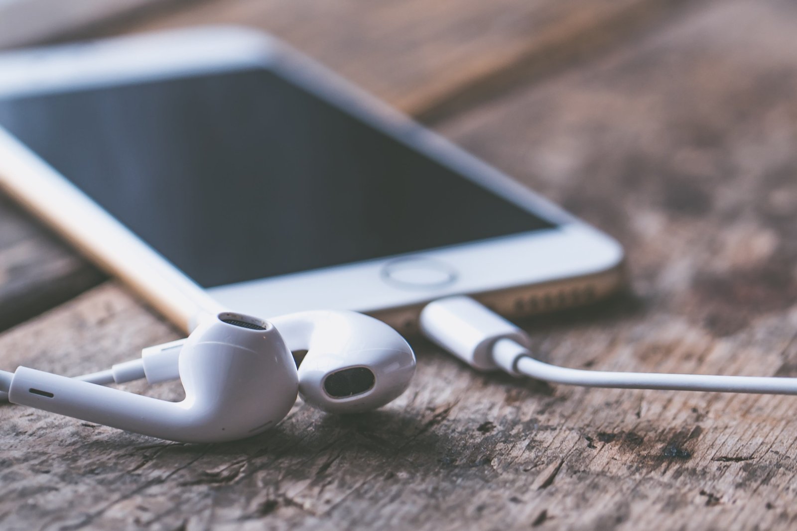 bokeh photography of Apple EarPods background blur business 2k 4k