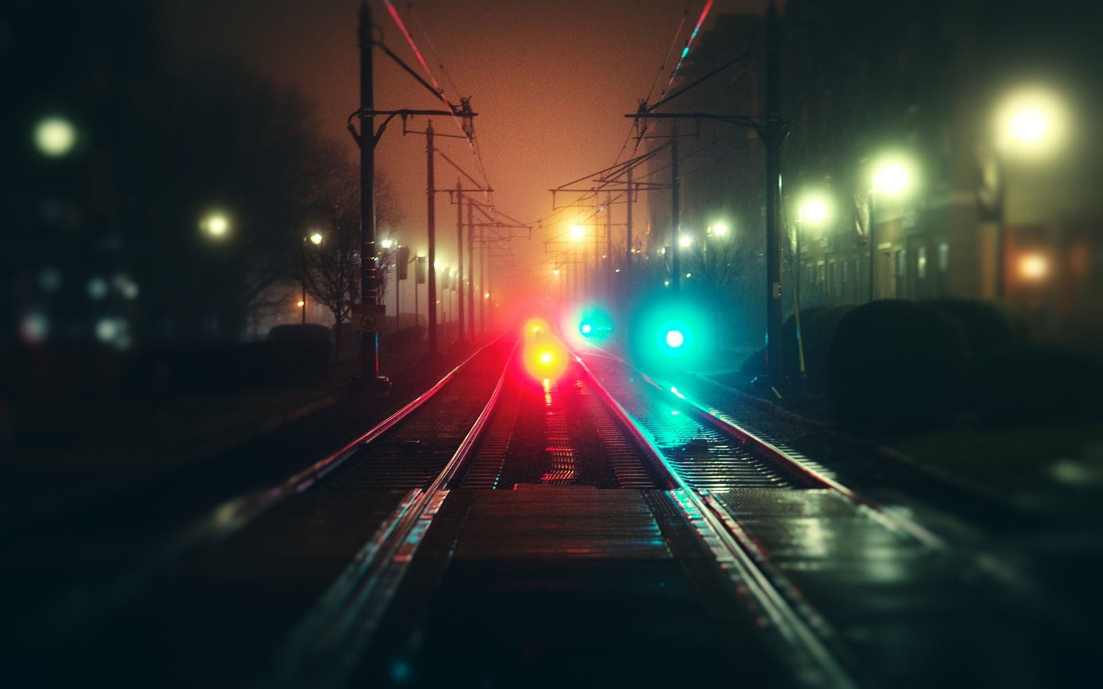 bokeh photography of train railway blurred night lights road 2k