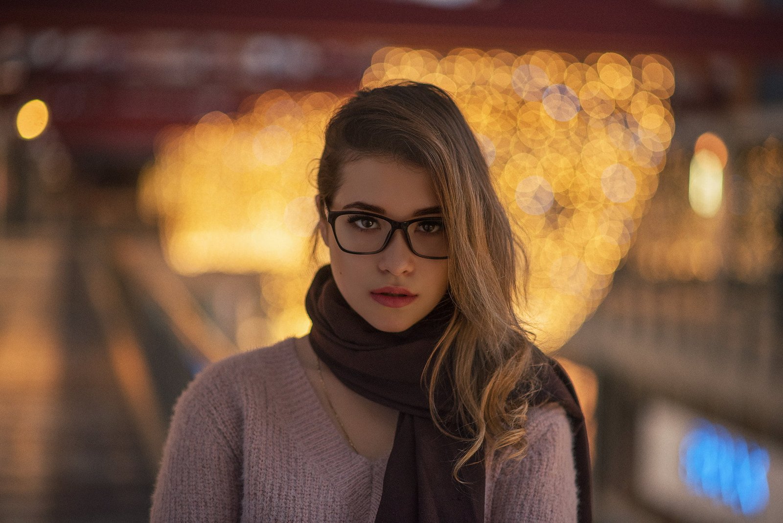 clear eyeglasses with black frames woman wears brown scoop neck knitted top 2k